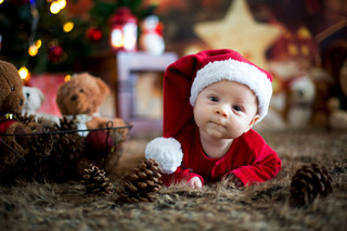 A baby in a Christmas hat